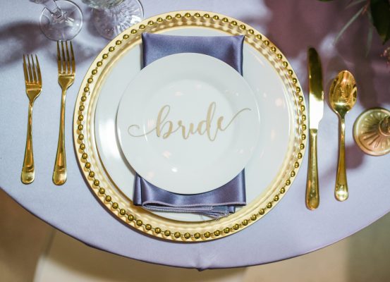 Purple table setting with dishes