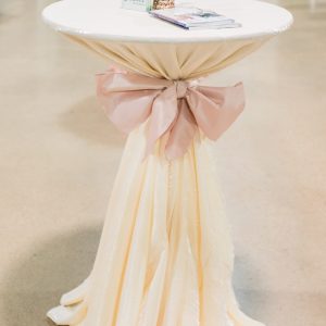 Ivory tablecloth with pink sash