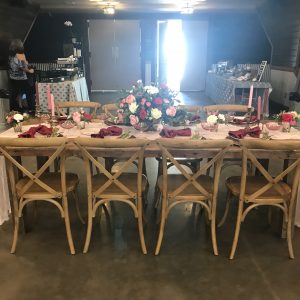 Wooden farm table with wood chairs