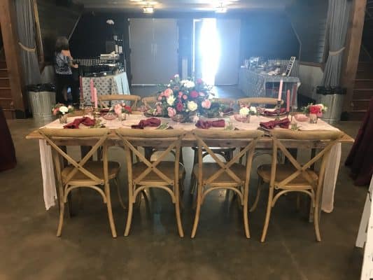 Wooden farm table with wood chairs