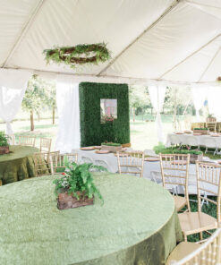 White tent with tables and chairs