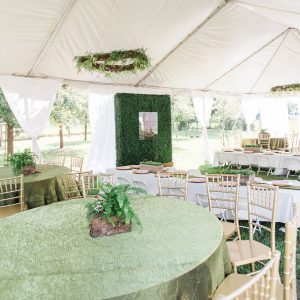 White tent with tables and chairs