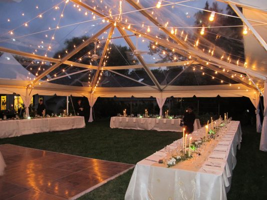 cafe lighting in a clear tent